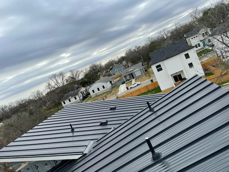 Standing seam metal roof panels with vents for Skylight Repair in Kenmore